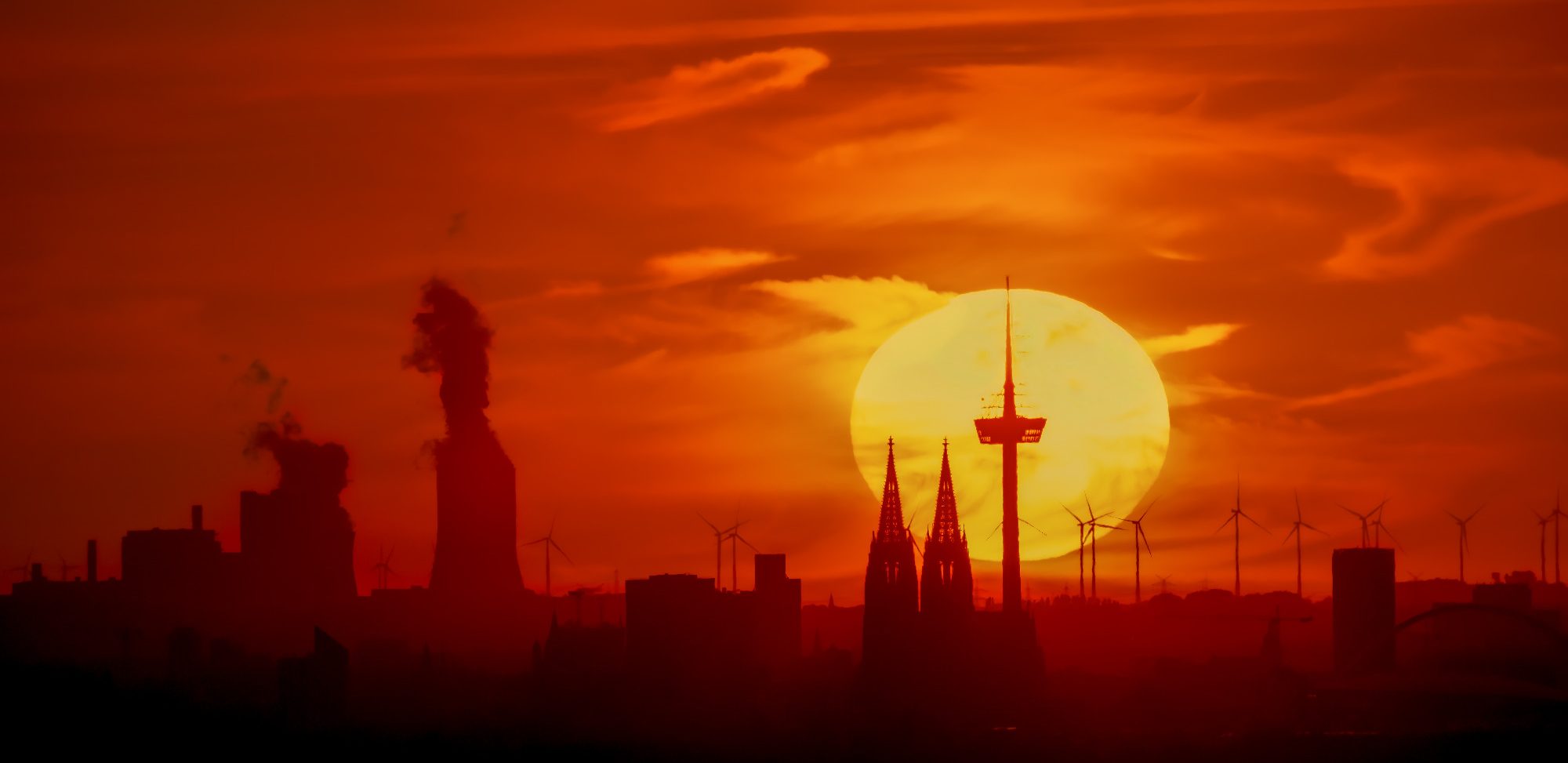 City of Flames Sunset over a city with striking buildings and silhouettes.