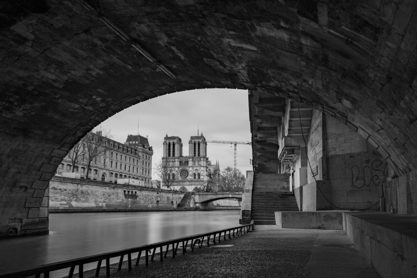 View of the river under an arch, with the silhouette