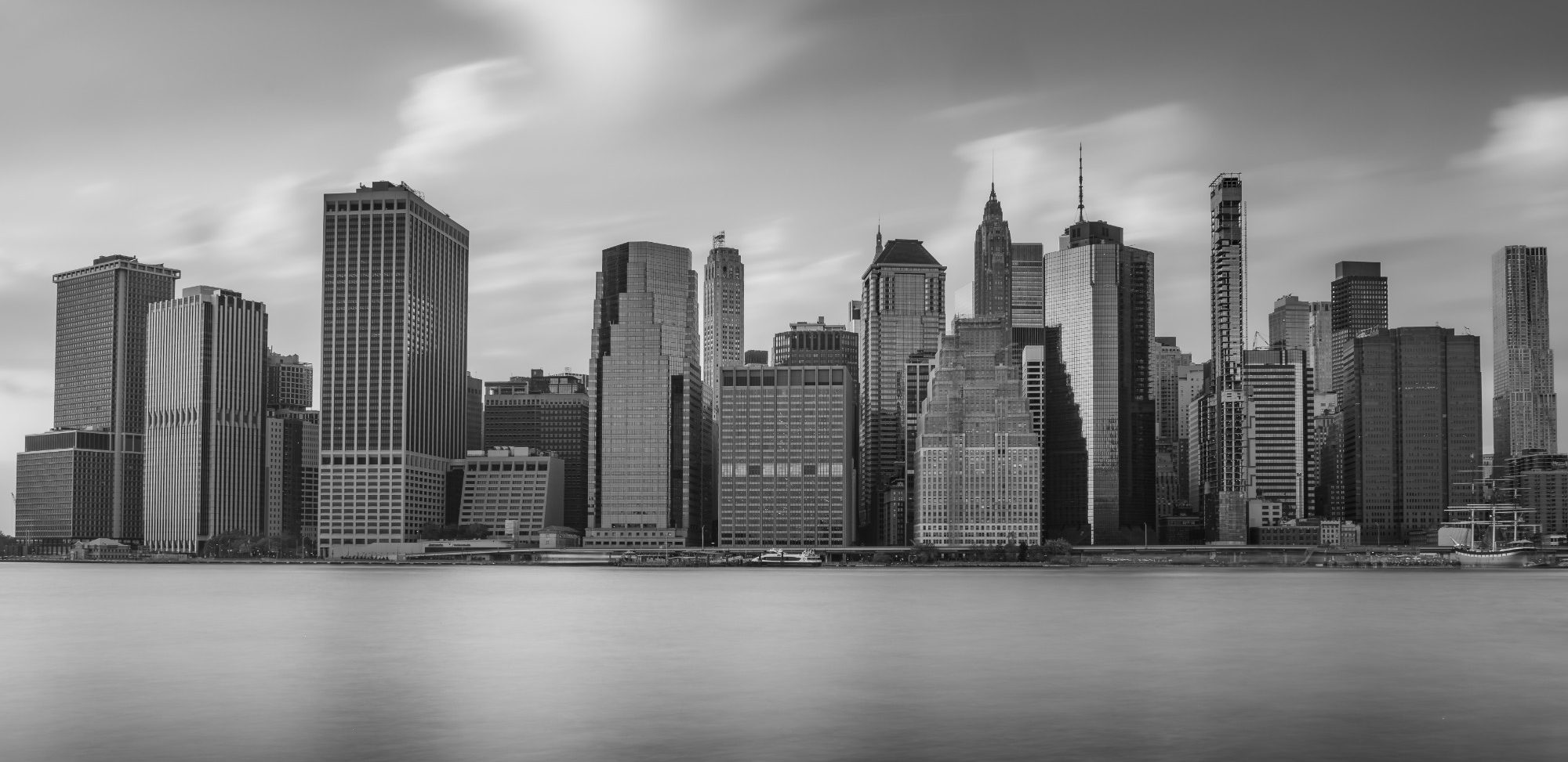 Monochrome Metropolis Black and white view of the skyline of a modern city on the water.